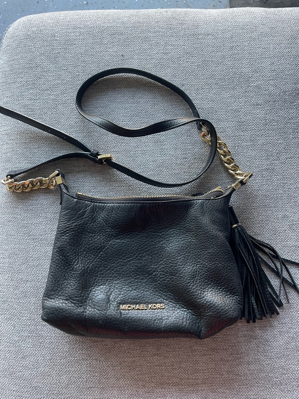 Michael Kors Black Leather Shoulder Bag with Gold Hardware and Tassel